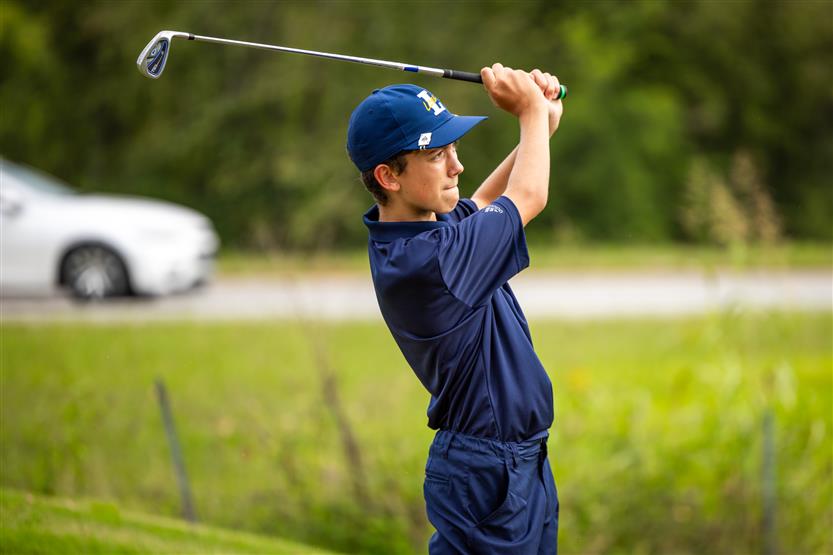Students play golf